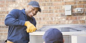 Technician working on an air conditioning unit