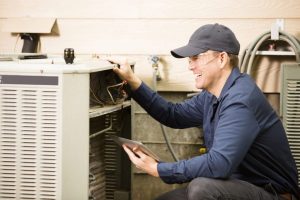 Technician working on AC unit